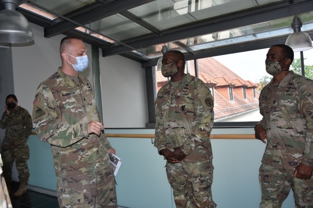 Lt. Col. James McWherter, commander of the Wiesbaden Health Clinic, talks with Lt. Gen. R. Scott Dingle and MEDCOM Command Sgt. Maj. Diamond Hough the U.S. Army Surgeon General and Commander of the U.S. Army Medical Command, during his visit to...