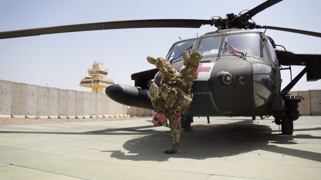 Staff Sgt. Brianna Pritchard, an Army National Guard UH-60 Black Hawk helicopter mechanic from Anchorage, Alaska, shows her Olympic breaking moves at Al Asad Air Base, Iraq. 