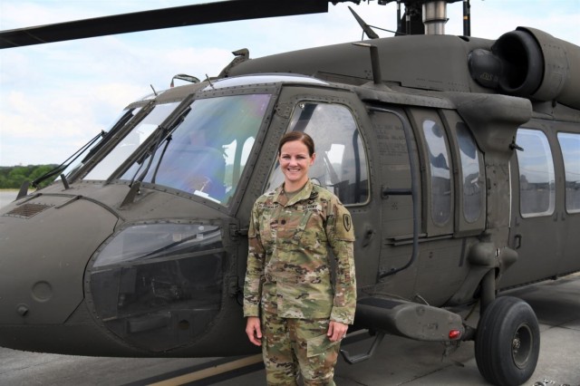 U.S. Army Lt. Col. Katherine Slingerland, 1st Battalion, 145th Aviation Regiment commander, 1st Aviation Brigade, U.S. Army Aviation Center of Excellence, stands in front of a UH-60 Black Hawk helicopter at Fort Rucker, Alabama, June 2, 2021.