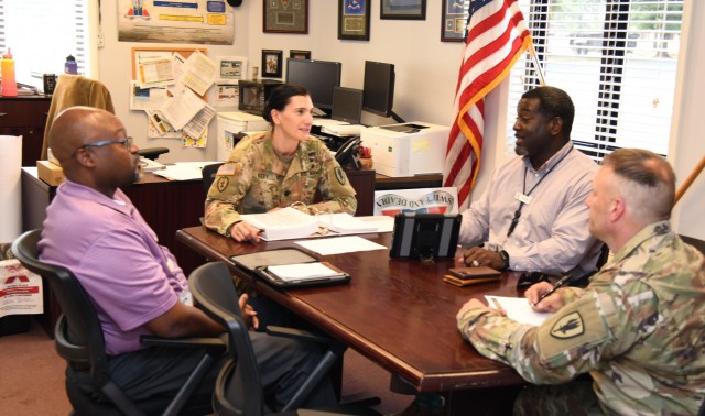 U.S. Army Lt. Col. Erica Witty, 1st Battalion, 13th Aviation Regiment commander, 1st Aviation Brigade, conducts a meeting in her office at Fort Rucker, Alabama, June 1, 2021.