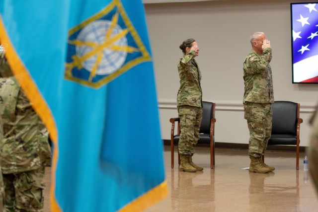 Chief of the Army Reserve Lt. Gen. Jody Daniels (left) and incoming commander Brig. Gen. Joseph Dziezynski, render a military salute to the U.S. flag during the national anthem at the Military Intelligence Readiness Command's assumption of command ceremony, Fort Belvoir, Virginia, June 5, 2021. (U.S. Army Reserve photo by Maj. Jeku Arce)