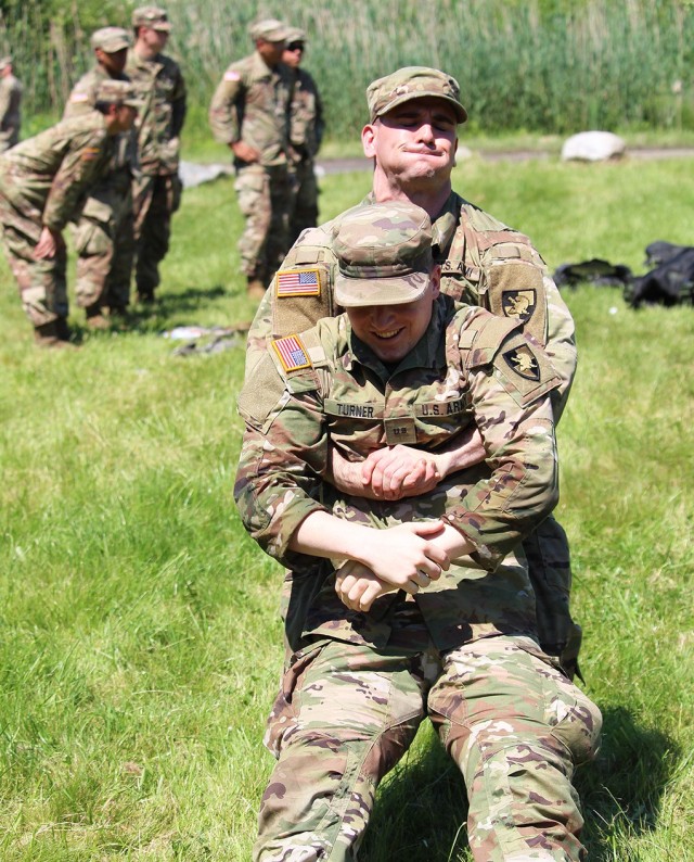 Cadets from Cadet Field Training’s 6th Company completed Combat Lifesaver recertification under the instruction of medics from Task Force Catamount from the 10th Mountain Division. This training involved the application of tourniquets, the administration of a needle-chest decompression (above), and the completion of tactical combat casualty care cards. They also received training on casualty movement techniques (below) and heat casualty prevention.   (Photo by Class of 2022 Cadet Caleb Gordon)