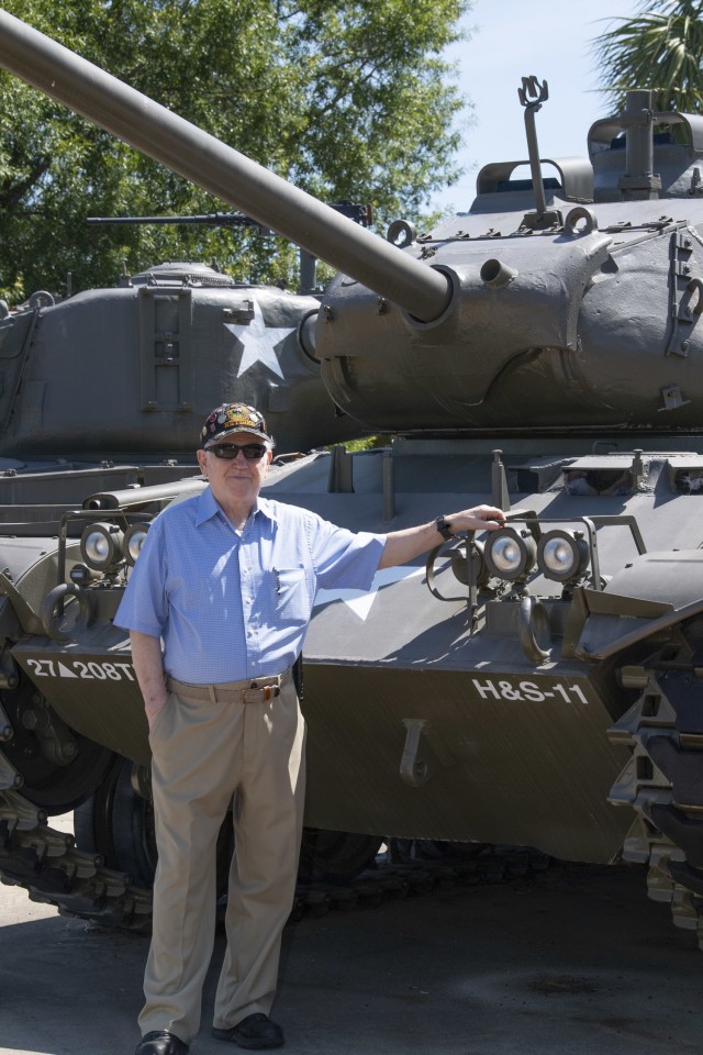 William Campbell stands in front of the M41A1 tank he served in during the 1950s. Campbell noticed the markings were those of the tank he crewed and it was later confirmed to be the same tank.
