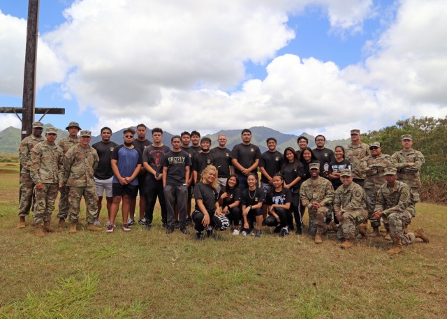 Future Soldiers pose for a photo as part of the 25th Infantry Division hosted Army National Hiring Days 2021 event on Schofield Barracks, Hawaii, June 7, 2021The Future Soldiers and applicants executed physical readiness training with 3rd Infantry Brigade Team, ate at the 25th Division Sustainment Brigade Bistro, observed an M119 Howitzer Fire Drill by 25th DIVARTY, visited an M4 range ran by 2nd Infantry Brigade Combat Team, watched a rappel demonstration at Lightning Academy, operated 25th Combat Aviation Brigade's helicopter simulators, attended the Division's weekly patching ceremony and executed an Oath of Enlistment Ceremony. 

(U.S. Army photo by Master Sgt. Andrew Porch, 25th Inf. Div.)