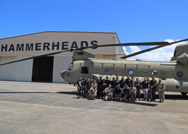 Light Fighters assigned to 25th Combat Aviation Brigade and Future Soldiers from the Hawaii Recruiting Company pose for a photo in front of a CH-47 Chinook as part of the 25th Infantry Division hosted Future Soldiers and applicants event in support of Army National Hiring Days 2021 on Schofield Barracks, Hawaii, June 7, 2021. The Future Soldiers and applicants executed physical readiness training with 3rd Infantry Brigade Team, ate at the 25th Division Sustainment Brigade Bistro, observed an M119 Howitzer Fire Drill by 25th DIVARTY, visited an M4 range ran by 2nd Infantry Brigade Combat Team, watched a rappel demonstration at Lightning Academy, operated 25th Combat Aviation Brigade's helicopter simulators, attended the Division's weekly patching ceremony and executed an Oath of Enlistment Ceremony. 

(U.S. Army photo by Master Sgt. Andrew Porch, 25th Inf. Div.)