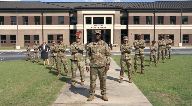 U.S. Army Training Center and Fort Jackson commander Brig. Gen. Milford H. 'Beags' Beagle Jr. poses with his "Squad" of post headquarters support staff during a "This Is My Squad" video shoot.