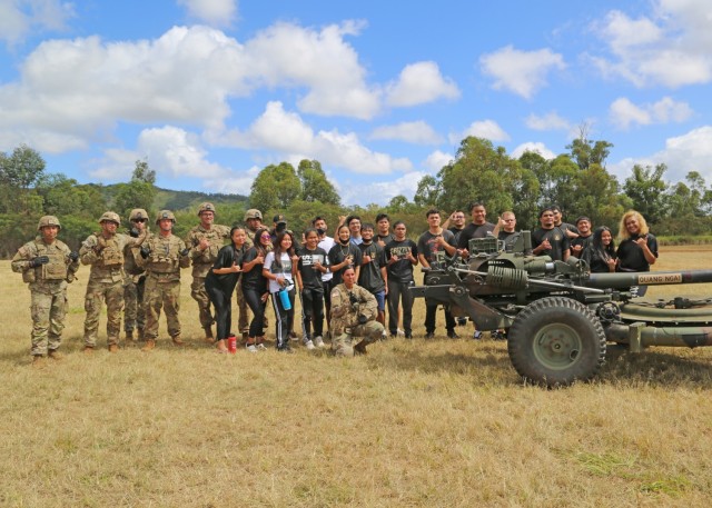 Light Fighters assigned to 25th Infantry Division Artillery and Future Soldiers pose for a photo as part of the 25th Infantry Division hosted Army National Hiring Days 2021 event on Schofield Barracks, Hawaii, June 7, 2021. The Future Soldiers and applicants executed physical readiness training with 3rd Infantry Brigade Team, ate at the 25th Division Sustainment Brigade Bistro, observed an M119 Howitzer Fire Drill by 25th DIVARTY, visited an M4 range ran by 2nd Infantry Brigade Combat Team, watched a rappel demonstration at Lightning Academy, operated 25th Combat Aviation Brigade's helicopter simulators, attended the Division's weekly patching ceremony and executed an Oath of Enlistment Ceremony. 

(U.S. Army photo by Master Sgt. Andrew Porch, 25th Inf. Div.)