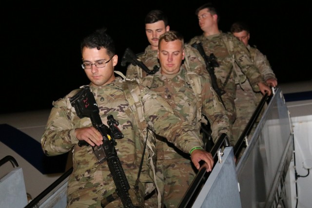 Soldiers with 1st Battalion, 28th Infantry Regiment, 3rd Infantry Division, depart an airplane at Yokota Air Base, Japan, June 8, 2021. These Soldiers will support Exercise Orient Shield 21-2 after completing a 14-day restriction of movement....