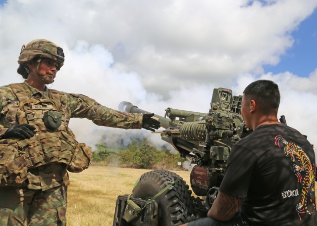 Silakivai Sunia, a Future Soldier with the Hawaii Recruiting Company pulls the lanyard of an M119 Howitzer as part of the 25th Infantry Division hosted Army National Hiring Days 2021 event on Schofield Barracks, Hawaii, June 7, 2021. The Future Soldiers and applicants executed physical readiness training with 3rd Infantry Brigade Team, ate at the 25th Division Sustainment Brigade Bistro, observed an M119 Howitzer Fire Drill by 25th DIVARTY, visited an M4 range ran by 2nd Infantry Brigade Combat Team, watched a rappel demonstration at Lightning Academy, operated 25th Combat Aviation Brigade's helicopter simulators, attended the Division's weekly patching ceremony and executed an Oath of Enlistment Ceremony. 

(U.S. Army photo by Master Sgt. Andrew Porch, 25th Inf. Div.)