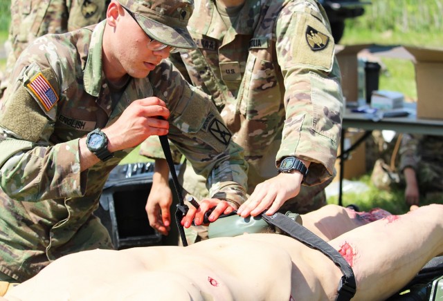 Cadets from Cadet Field Training’s 6th Company completed Combat Lifesaver recertification under the instruction of medics from Task Force Catamount from the 10th Mountain Division. This training involved the application of tourniquets, the administration of a needle-chest decompression (above), and the completion of tactical combat casualty care cards. They also received training on casualty movement techniques (below) and heat casualty prevention.    (Photo by Class of 2022 Cadet Caleb Gordon)