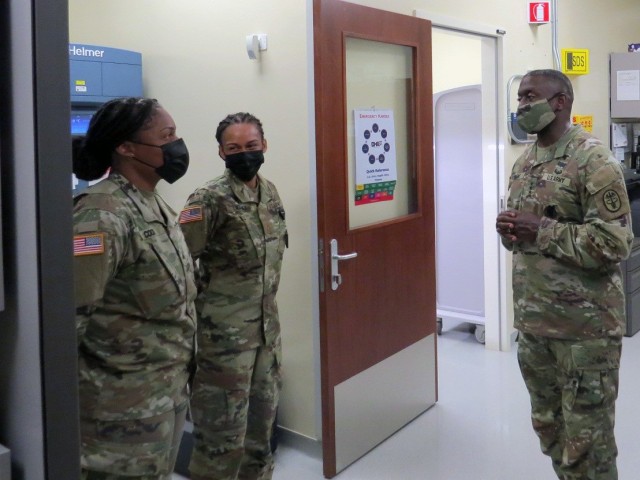 Lt. Gen. R. Scott Dingle, the 45th Surgeon General of the United States Army and Commanding General, United States Army Medical Command talks with Sgt. Laterra Cook, the noncommissioned offer in charge of the Vicenza pharmacy, and Maj. Brittany Latimer, the officer in charge of the Vicenza pharmacy during his visit to the Vicenza Army Health Clinic, June 8.  (U.S. Army photo by Del Campbell)