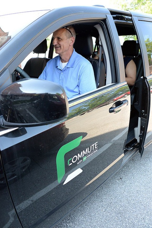 Vanpool participants Martin Braun, military analyst at Headquarters, Combined Arms Center, and Von Henderson, command security specialist for the Mission Command Training Program, prepare to begin their commute from Fort Leavenworth to their homes in the Lawrence and Topeka, Kan., areas June 3, 2019, from their meeting spot by the Directorate of Public Works building on McClellan Ave. File photo by Prudence Siebert/Fort Leavenworth Lamp