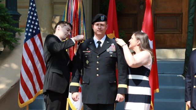 U.S. Army Brig. Gen. Gavin Gardner’s wife and son pin the insignia of Gardner’s new rank onto his uniform during his promotion ceremony June 10, 2021.