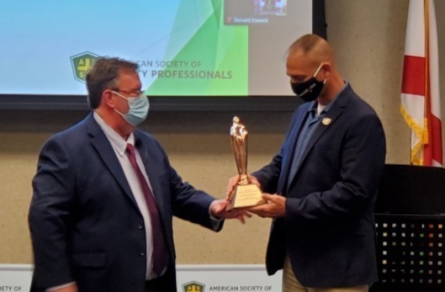 Shawn Ankerich, a health and safety specialist, receives a Safety Professional of the Year Award during a ceremony hosted by the American Society of Safety Professionals Alabama Chapter.