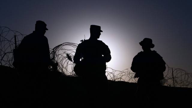 Soldiers from the 131st Field Hospital await their teammates as the sun rises over Fort Bliss, Texas, June 5, 2021. The Guardian Knights are currently testing their ability to stand up operations in an austere environment as part of field exercise...