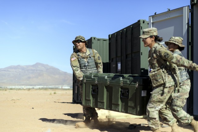 Soldiers from the 131st Field Hospital unpack a cargo container at Camp Old Ironsides, Fort Bliss, Texas, June 5, 2021. As part of field exercise Operation Guardian Readiness, Guardian Knight Soldiers stood up their Role 3 medical facility in an...