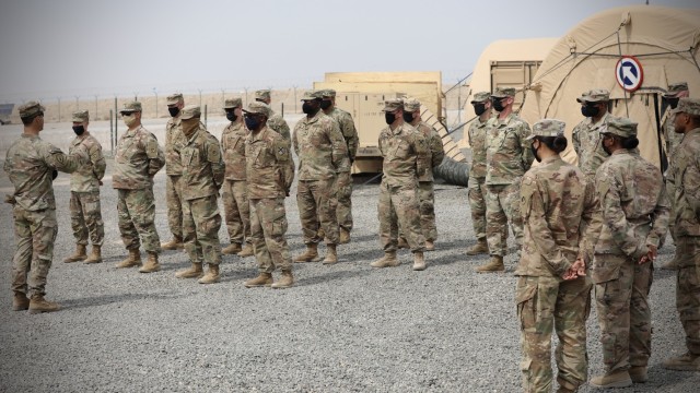 Lt. Col. Brian Kibitlewski, commander, Special Troops Battalion, 1st Theater Sustainment Command, addresses Soldiers during an awards ceremony at Camp Arifjan, Kuwait, Apr. 22, 2021. The team was an integral part of setting up the expeditionary command post that gives the TSC the ability to have a forward operating capability to provide operational level sustainment support to operations anywhere in the world. (U.S. Army photo by Sgt. 1st Class Noel Gerig, 1st TSC Public Affairs)