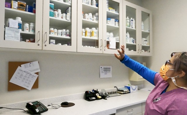 Juliana Alvarez, an animal health technician at the Fort Shafter Veterinary Activity, directs a tour of the pharmacy while describing the process of obtaining American Animal Hospital Association accreditation, May 19. For months the VETAC team...