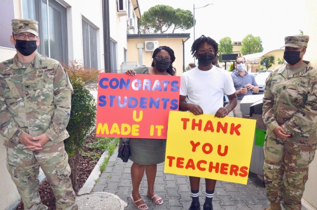 VICENZA, Italy - Soldiers and family members of the Vicenza Military community thank teachers, students and all school staff as they await the exit of the Vicenza High School students on the last day of school June 10, 2021.
...