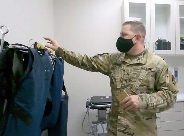 Sgt. Clayton L. Gerrion, an animal care noncommissioned officer at the Fort Shafter Veterinary Activity, directs a tour of the radiology suite while describing the process of obtaining the American Animal Hospital Association accreditation, May...