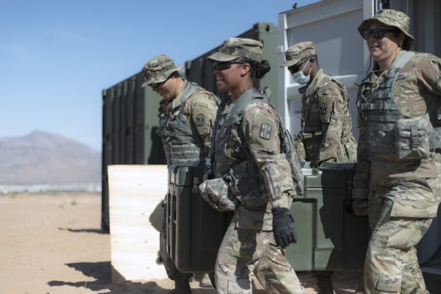 Soldiers from the 131st Field Hospital unpack a cargo container at Camp Old Ironsides, Fort Bliss, Texas, June 5, 2021. As part of field exercise Operation Guardian Readiness, Guardian Knight Soldiers stood up their Role 3 medical facility in an austere environment.