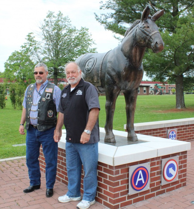 Rich Gano, Legion Riders commander and Bobby Castle, Legion Riders director, American Legion Post 113 in Elizabethtown, Kentucky, stand with the Blackjack statue in front of the 1st Theater Sustainment Command headquarters, May 11, 2021 in Fort...