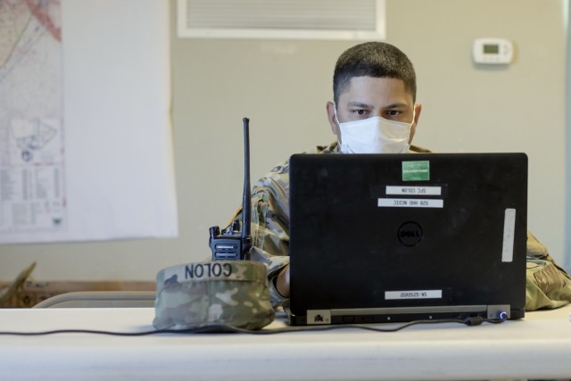 A senior non-commissioned officer monitors the 131st Field Hospital’s field exercise from the tactical operations center at Camp Old Ironsides, Fort Bliss, Texas, June 5, 2021.