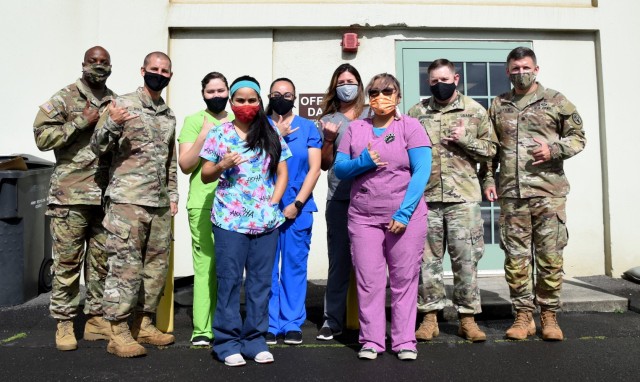 The Fort Shafter Veterinary Activity staff stand outside their clinic at Fort Shafter, Hawaii, May 28. For months, the team worked toward obtaining American Animal Hospital Association accreditation, a process that covers 19 functional areas which...