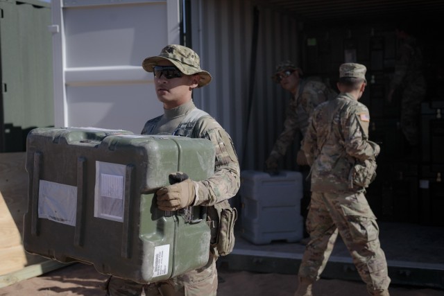 Soldiers from the 131st Field Hospital unpack a cargo container at Camp Old Ironsides, Fort Bliss, Texas, June 5, 2021. As part of field exercise Operation Guardian Readiness, Guardian Knight Soldiers stood up their Role 3 medical facility in an...