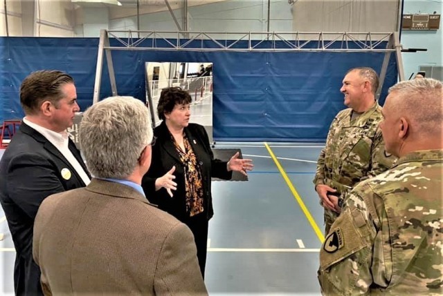 Brenda Lee McCullough, director of Installation Management Command (IMCOM)-Readiness, talks with garrison leadership June 8, 2021, in Rumpel Fitness Center at Fort McCoy, Wis. McCullough and Command Sgt. Maj. Dan Dennison, IMCOM-Readiness command...