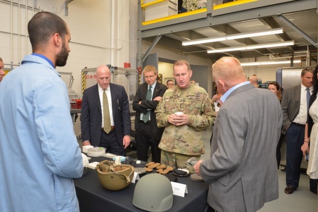 Lt. Gen. Thomas H. Todd III, Deputy Commanding General of Acquisition and Systems Management at Army Futures Command, discusses helmet and ballistic protection with DEVCOM Soldier Center Technical Director, Doug Tamilio, at the Low Velocity Ballistic Lab, during a tour of Soldier Center facilities and technologies after hosting the change of Command ceremony for the Natick Soldier Systems Center’s Senior Mission Commander on June 8 in Natick, Massachusetts.