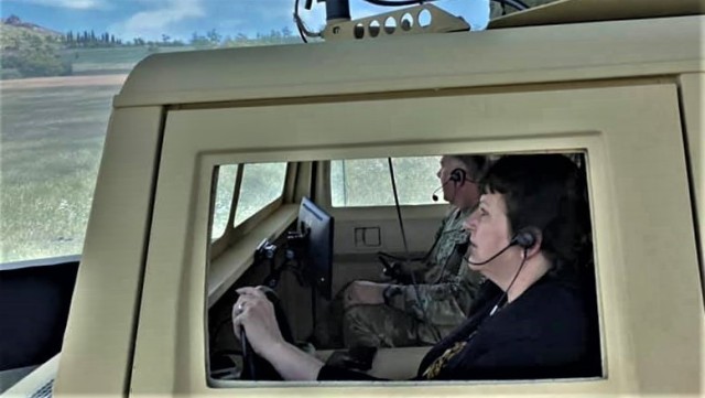 Brenda Lee McCullough, director of Installation Management Command (IMCOM)-Readiness, and Garrison Commander Col. Michael Poss participate in a simulations training scenario June 8, 2021, at a simulations training facility at Fort McCoy, Wis....