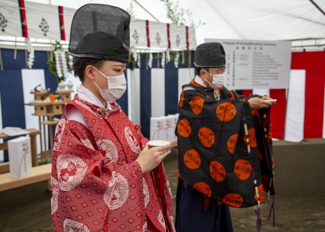 Leadership from the U.S. Army Corps of Engineers, 374th Airlift Wing, and NIPPO Corp. gather for a “Jichinsai” or "land-appeasing ceremony" during a groundbreaking, June 4 at Yokota Air Base. This is an ancient Japanese ceremony is held before the commencement of the AFSOC CV-22 Osprey Facility Simulator project - a critical build for the U.S. Japan Alliance and the region. The priests will pray for the prosperity of the owner and occupants of the building once the simulator comes to fruition. (Photo by Luis Casale)