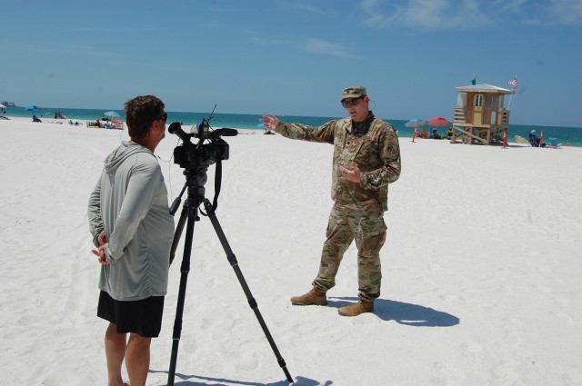 Lt. Col. Todd Polk, the deputy district commander for South Florida is interviewed by Tim Burquest, a news reporter from WTSP, CBS in St. Petersburg after the completion ceremony for the recently completed Lido Beach renourishment project on at Lido Beach on May 27, 2021. 