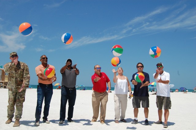 Here hitting the celebratory beach balls are from left to right:  U.S. Army Corps of Engineers Lt. Col. Tom Polk, Kenny Poindexter, Triston Brown, Milan Mora, Erin Duffy, Andy Cummings, and Mike Mckay.  The City of Sarasota hosted a celebration for the recently completed Lido Beach renourishment project on at Lido Beach on May 27, 2021.   