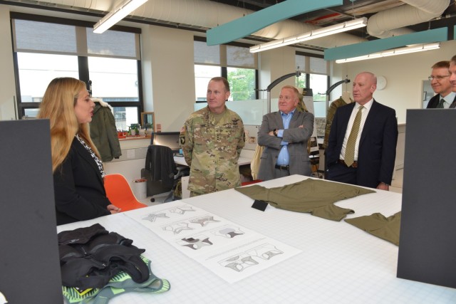 Lt. Gen. Thomas H. Todd III, Deputy Commanding General of Acquisition and Systems Management at Army Futures Command, DEVCOM Soldier Center Technical Director Doug Tamilio, and Mr. John Willison, Deputy to the Commanding General of U.S. Army DEVCOM, listen to Annette LaFleur, a Supervisory Clothing Designer at DEVCOM Soldier Center’s Design and Pattern Prototype Studio, talk about female Soldier uniform items during a tour of Soldier Center labs and technologies after Todd hosted a Change of Command ceremony for the Natick Soldier Systems Center Senior Mission Commander on June 8 in Natick, Massachusetts.

