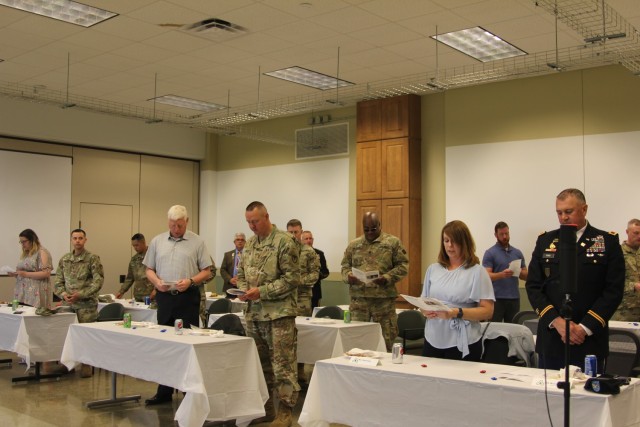 Fort McCoy, Wis., community members sing a song during the Memorial Day Prayer Luncheon, held May 27 at the installation. The Religious Support Office organizes prayer lunches for both Memorial Day and Labor Day each year. (U.S. Army photo by...