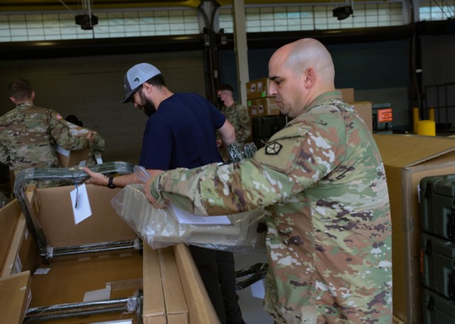 Sgt. Daniel Halsey, V Corps Headquarters and Headquarters Battalion Senior Medic, helps unload shipments of medical supplies at the V Corps Motor pool, June 2, 2021 at Fort Knox, Kentucky. The V Corps medical team received essential medical field equipment, including some of the nation’s best military grade products to help ensure improved resiliency and quicker mental and physical healing for V Corps Soldiers.