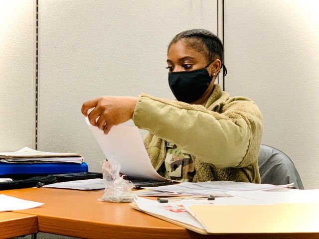 Spc. Zandra McLemore, Patient Administration Specialist, 339 Medical Unit,  processes SRP documents enabling Soldier mobilization and movement.