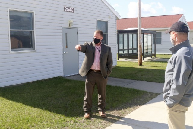 Brandon Strait, left, program manager Science Applications International Corporation, and John Bowyer, project lead, senior network engineer, SAIC, discuss the improvements and changes coming to Fort McCoy, Wis., in order to support a mission...