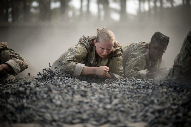 Trainees of Charlie Company, 2nd Battalion, 60th Infantry regiment low crawl toward the finish line of the &#34;Fit To Win&#34; endurance course during week 2 of basic combat training at Fort Jackson, SC. The installation trains 50 percent of the U.S. Army&#39;s basic combat training load and more than 60 percent of all women entering the Army each year. 
