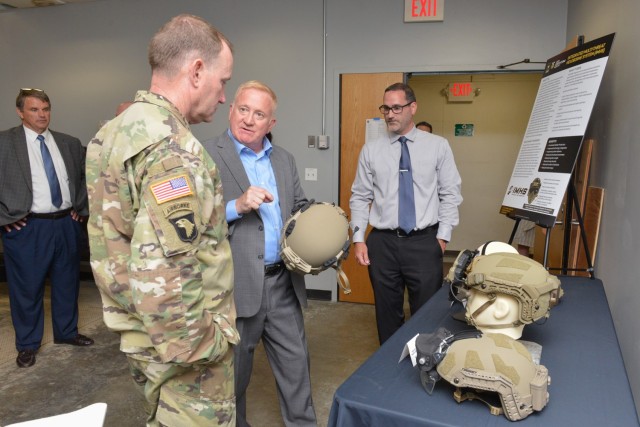 DEVCOM Soldier Center technical director Doug Tamilio shows the Integrated Multi-Threat Headborne System (IMHS) during a stop at the Low Velocity Ballistics Lab while touring Soldier Center Labs and technologies after Todd hosted the Change of Command ceremony for the Natick Soldier Systems Center Senior Mission Commander on June 8 in Natick, Massachusetts.