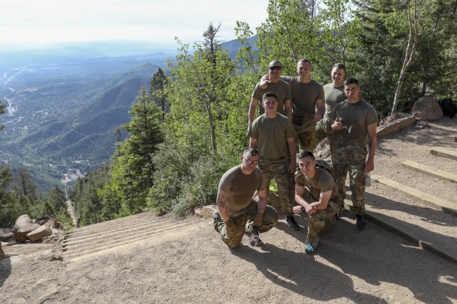 The seven Soldiers who competed in the annual U.S. Army Space and Missile Defense Command Best Warrior Competition stand atop the Manitou Incline in Colorado Springs, Colorado, June 10, 2021. The Soldiers partook in a four-day series of strenuous events to test their physical abilities and Army skills. (U.S. Army National Guard photo by Staff Sgt. Zach Sheely)