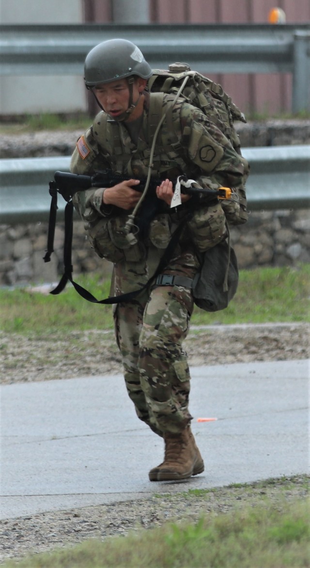 Dr. (Maj.) Edward Chang, a head and neck surgeon with Brian D. Allgood Army Community Hospital and Command Surgeon of the 19th Expeditionary Sustainment Command, completes the 12-mile ruck march as part of the Expert Field Medical Badge competition, May 21, 2021, at Rodriguez Multi-Purpose Live Fire Complex, commonly known as Rodriquez Range.