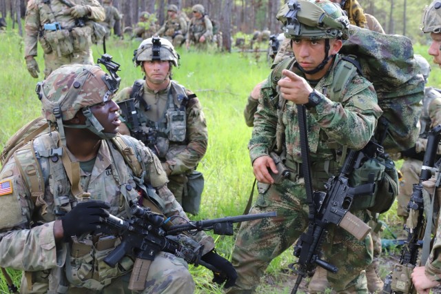 A U.S. Army solider, left, and a Colombian Army soldier, right, train together at the Joint Readiness Training Center at Fort Polk, La., June 9, 2021. The Colombian Army is the second South American army to conduct bilateral training with a U.S. Army unit as part of a JRTC rotation.