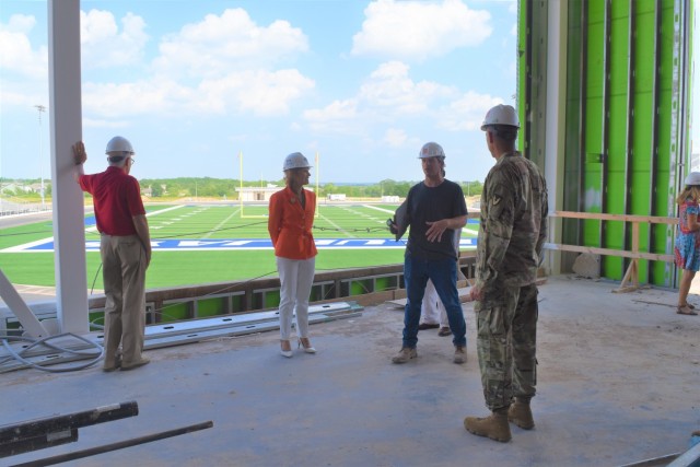 Malcolm Watkins, third from left, architect of the new Junction City High School, discusses the new Junction City High School’s design with Mark Edwards, civilian aide to the secretary of the Army emeritus; Maria McConville, spouse of Gen. James...