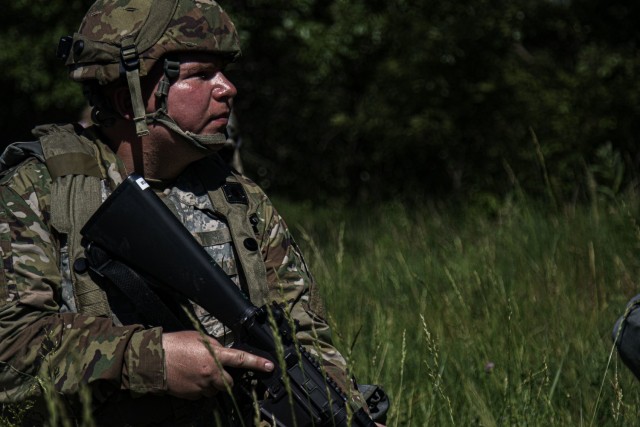 Spc. Christopher Lambert, a human resources specialist for the 463rd Engineer Battalion, stands perimeter security during an automobile rollover simulation, June 9, 2021 at Fort McCoy, Wis.The 463rd is utilizing Warrior Exercise 86-21-02 as an opportunity to refine their Soldiers’ ability establish tactical assembly areas, defensive posturing, convoy operations and maintenance, vertical and horizontal construction, and fundamental Soldier skills. (U.S. Army Reserve photo by Sgt. Michael Ito, 364th TPASE)