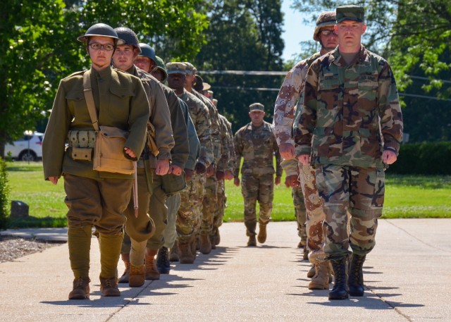 Soldiers from the Noncommissioned Officers Academy march in uniforms from World War I to the present, then perform a Retreat Ceremony June 14 on MSCoE Plaza.