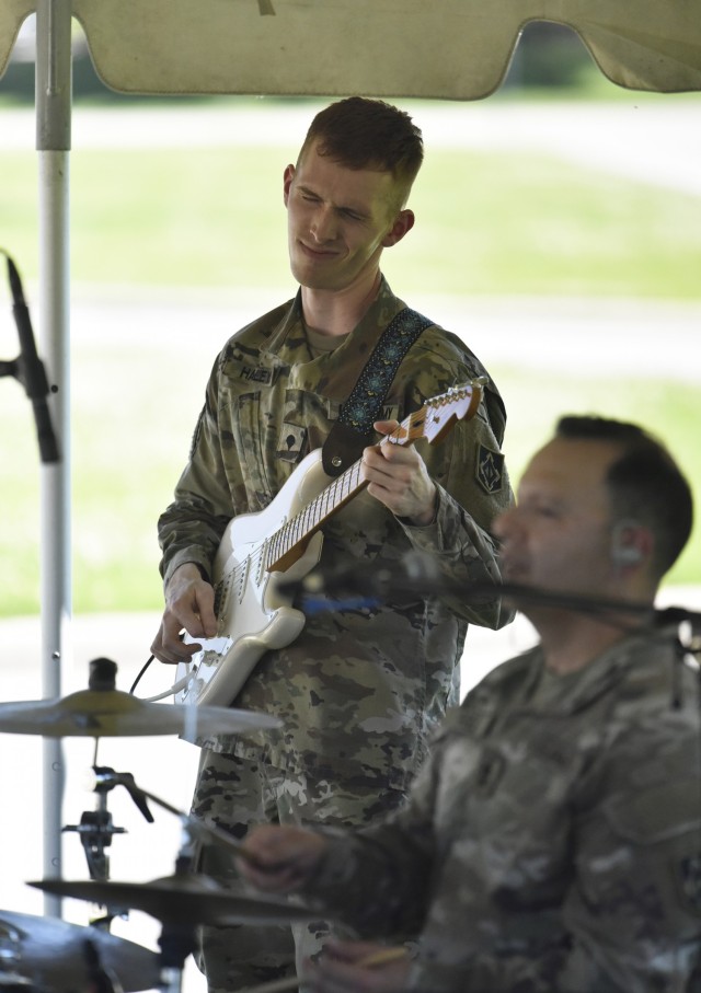 Spc. Patrick Haley, from the 399th Army Band, gets into the music during a performance prior to the Army Birthday Retreat Ceremony June 14 at MSCoE Plaza.
