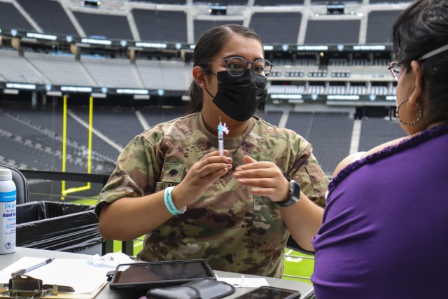 Nevada National Guard Spc. Dulce Alaniz with Joint Task Force 17 prepares to administer the one-shot Janssen vaccine to a citizen at Allegiant Stadium in Las Vegas June 10, 2021. The Nevada Guard has been on the front lines of the COVID-19 battle...